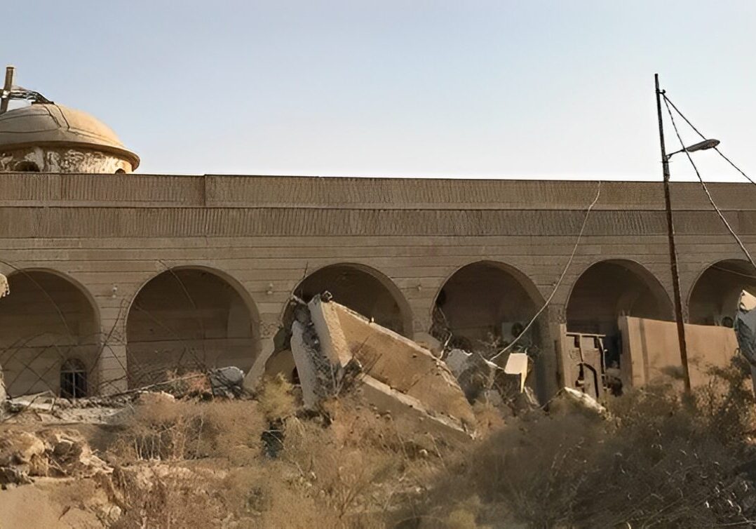 Destroyed church with debris in foreground.